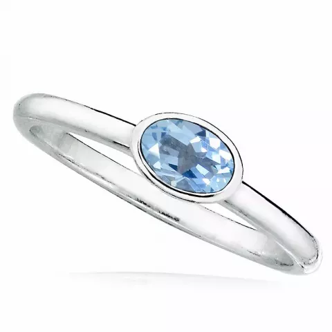 oval blå ring i rodinert sølv