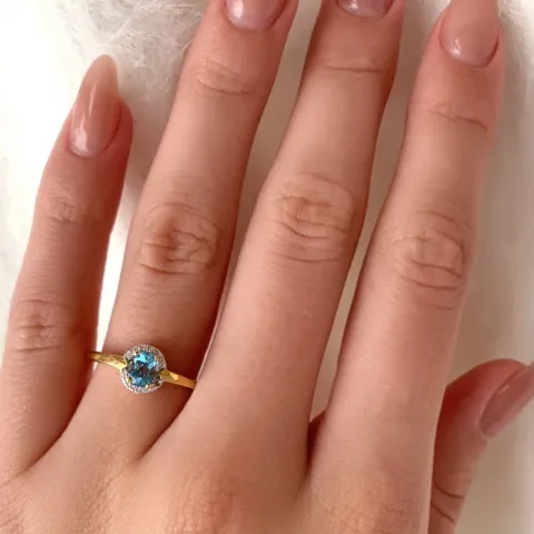 Ekte oval topas ring i 9 karat gull med rhodium