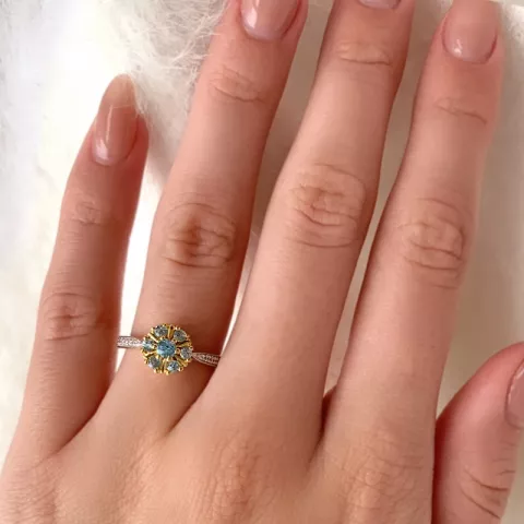blomst blå topas ring i 9 karat gull med rhodium