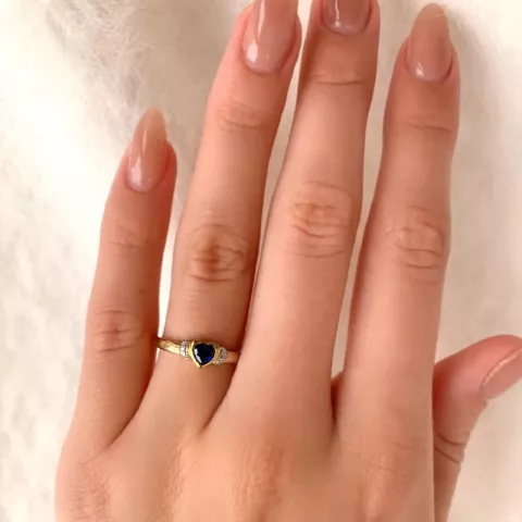 Blank hjerte blå ring i 9 karat gull med rhodium