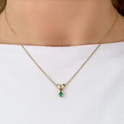 grønn smaragd anheng i 14 karat gull 0,22 ct