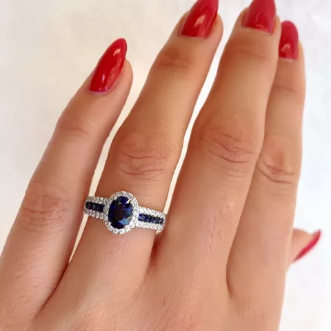 oval blå safir diamantring i 14 karat hvitt gull 0,286 ct 
