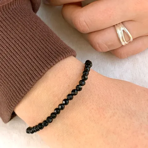 svart onyks armbånd i sateng  x 4 mm