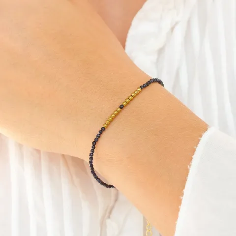 mørkeblå metallic armbånd med stein og hematite.