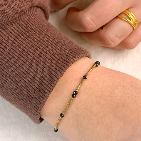 forgylt stein armbånd med hematite og spinell.