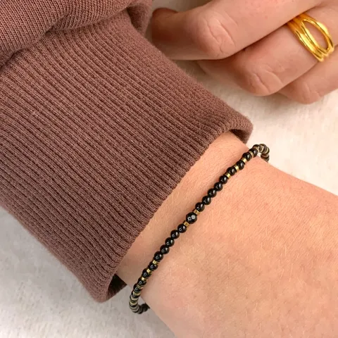 svart armbånd med onyks og hematite.