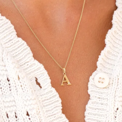 bokstav a diamant anheng i 9 karat gull 0,01 ct