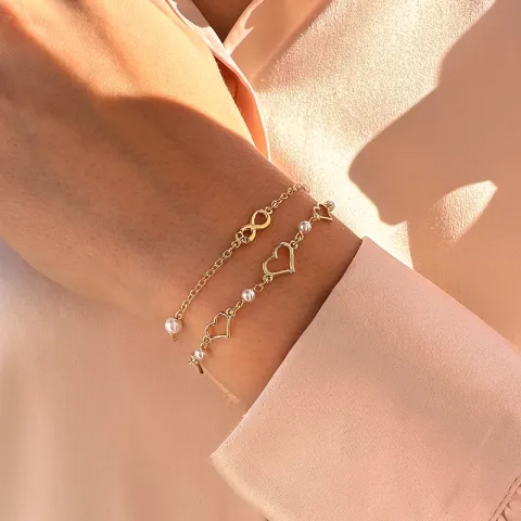infinity armbånd i forgylt sølv med anheng i forgylt sølv