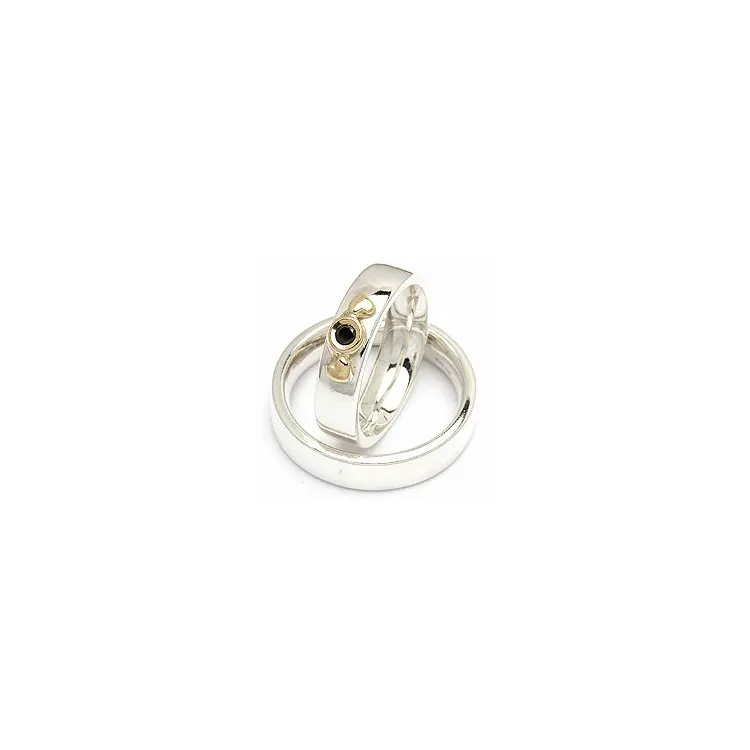 Gifteringer fra rs of scandinavia i sølv og alm. gull 0,05 ct