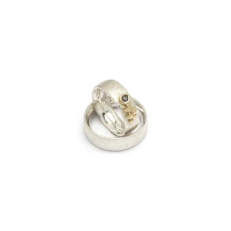 Gifteringer fra rs of scandinavia i sølv og alm. gull 0,05 ct
