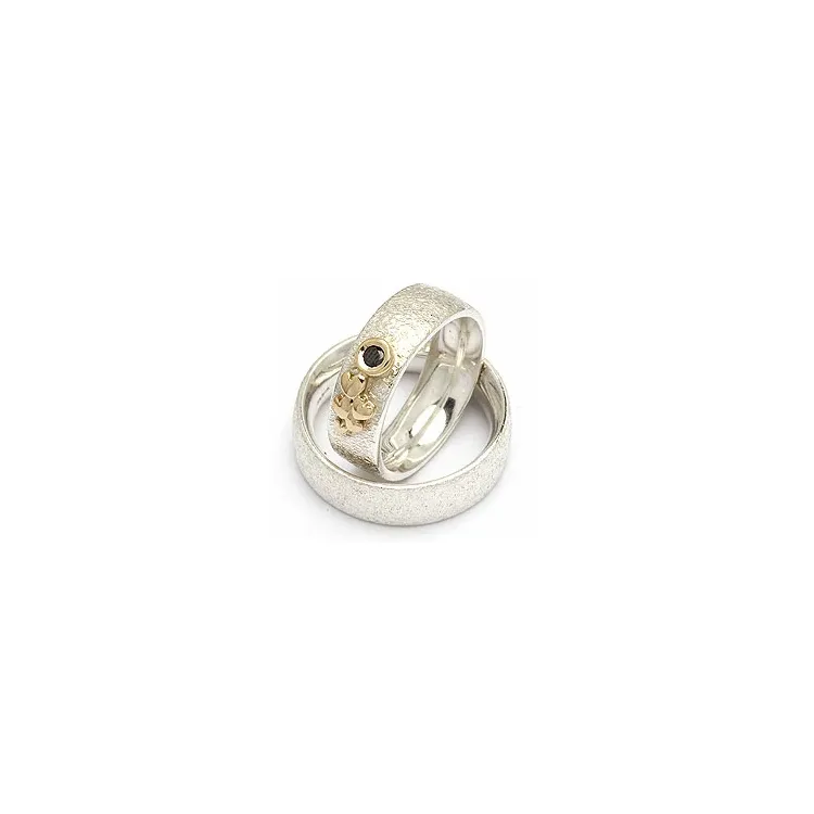 Gifteringer fra rs of scandinavia i sølv og alm. gull 0,05 ct