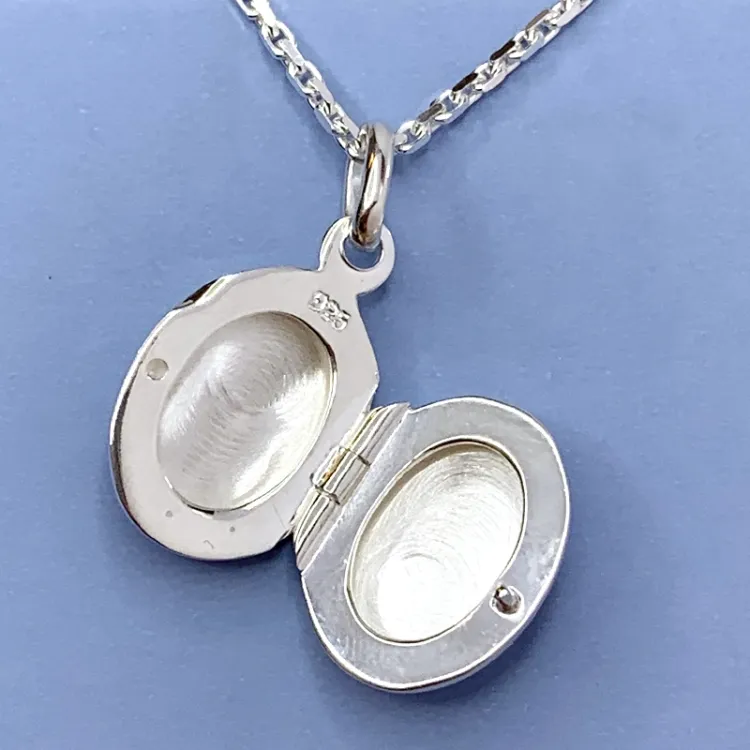 12 x 15 mm ovalt medaljong i sølv