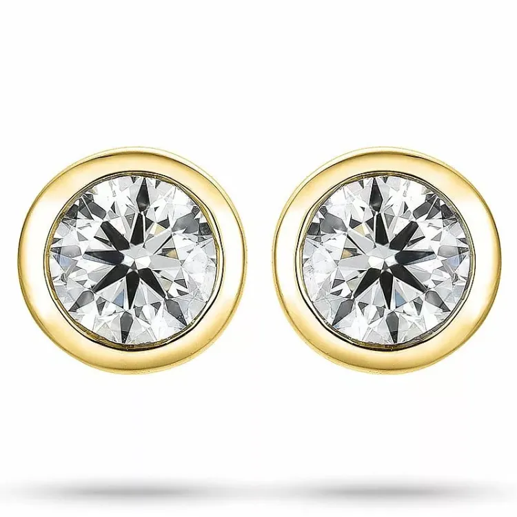2 x 0,25 ct solitaireørepynt i 14 karat gull med diamant