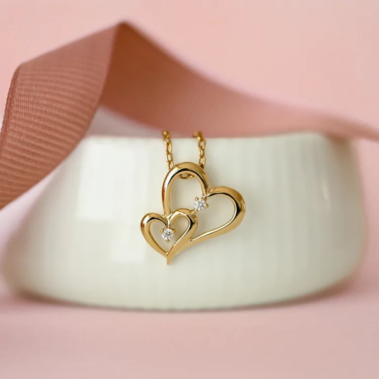 hjerte anheng i 14 karat gull 0,06 ct