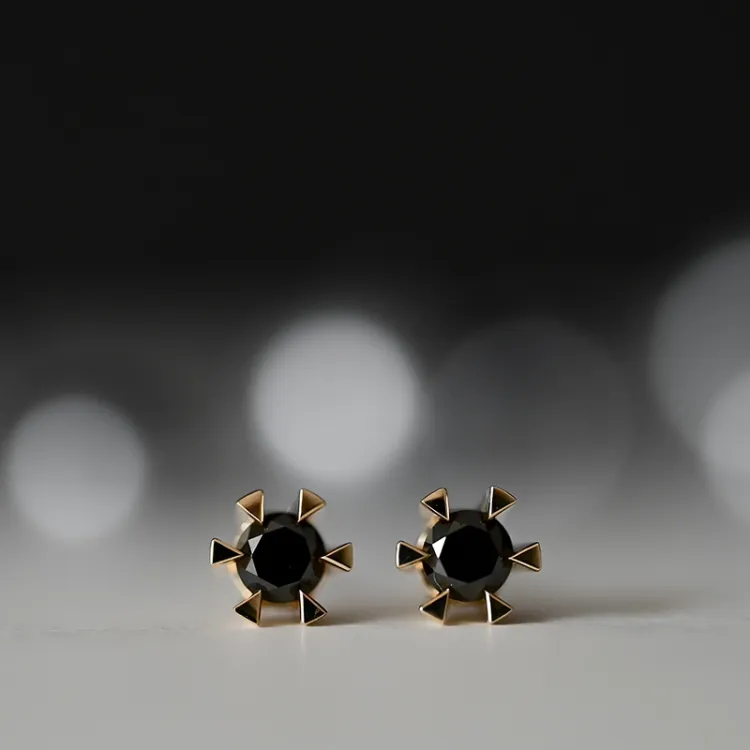 2 x 0,21 ct svart solitaireørepynt i 14 karat gull med svart diamant