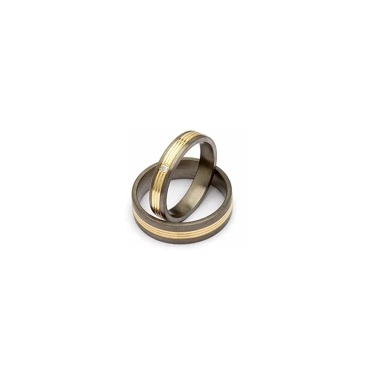 Gifteringer i titanium og alm. gull 0,025 ct