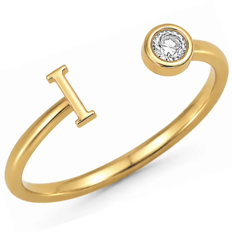 bokstav i zirkon ring i forgylt messing