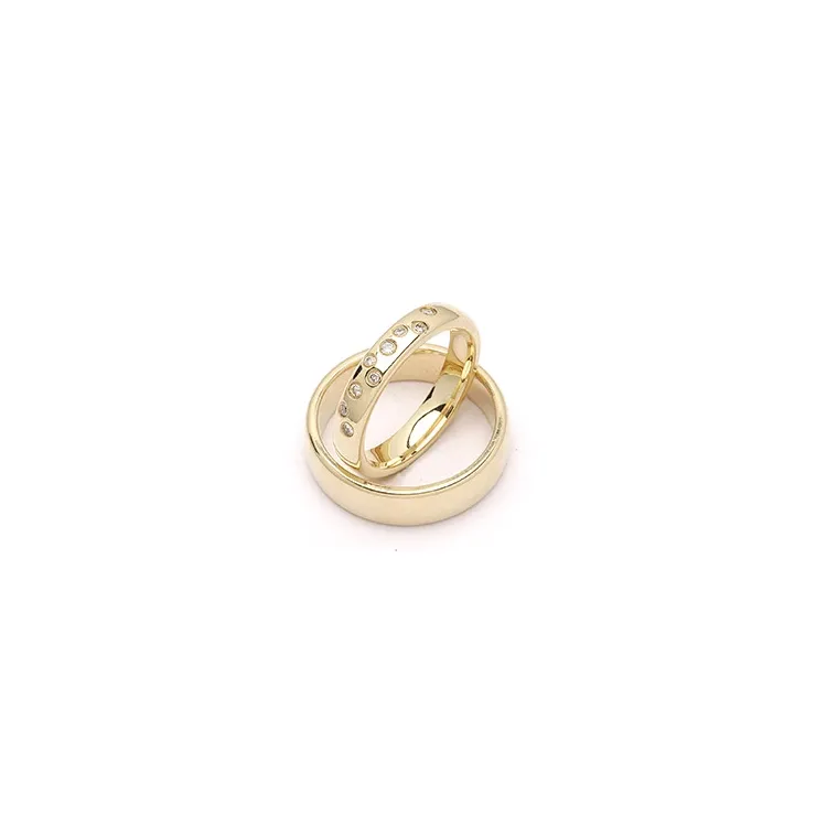Stjernedryss gifteringer i 9 karat gull 0,126 ct - par