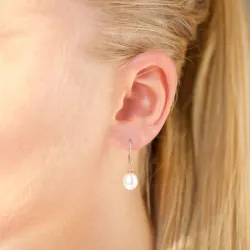 Ovale 7 - 8 mm aaa-gradert ferskvannsperle øredobber i 14 karat gull med 