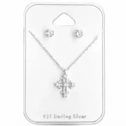 Kors sett med øredobber og halskjeder i sølv