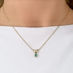 grønn smaragd anheng i 14 karat gull 0,22 ct